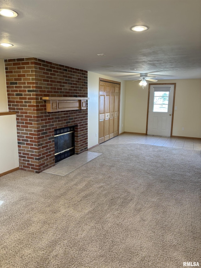 2110 Magnolia Dr, Jacksonville, IL 62650 - unfurnished living room with baseboards, ceiling fan, a fireplace, carpet floors, and recessed lighting