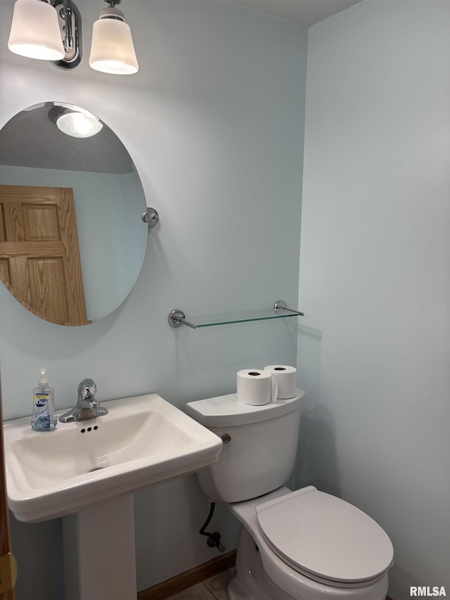 2110 Magnolia Dr, Jacksonville, IL 62650 - bathroom featuring a sink and toilet