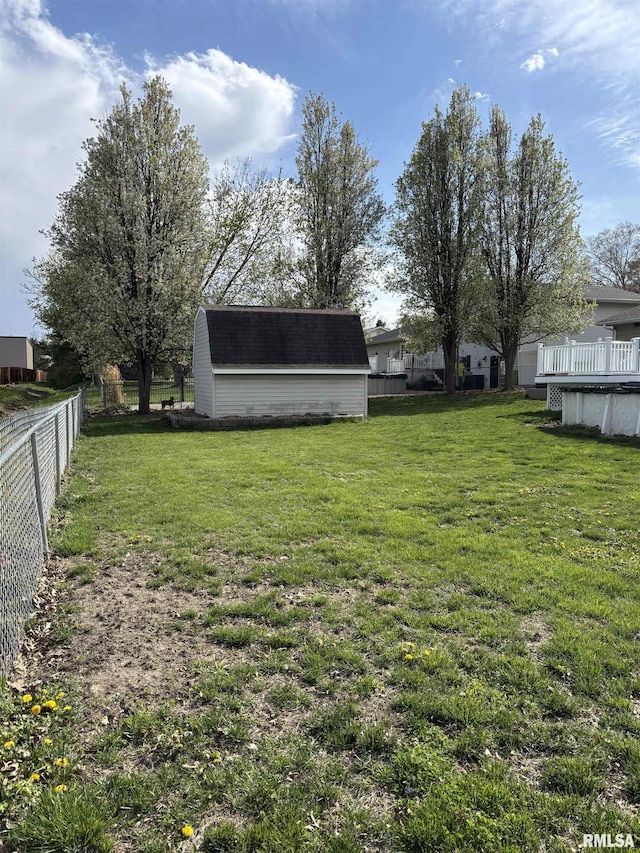 2110 Magnolia Dr, Jacksonville, IL 62650 - view of yard with a covered pool, a fenced backyard, an outbuilding, and a storage unit