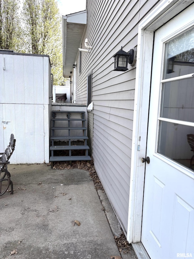 2110 Magnolia Dr, Jacksonville, IL 62650 - view of side of home featuring fence and a patio