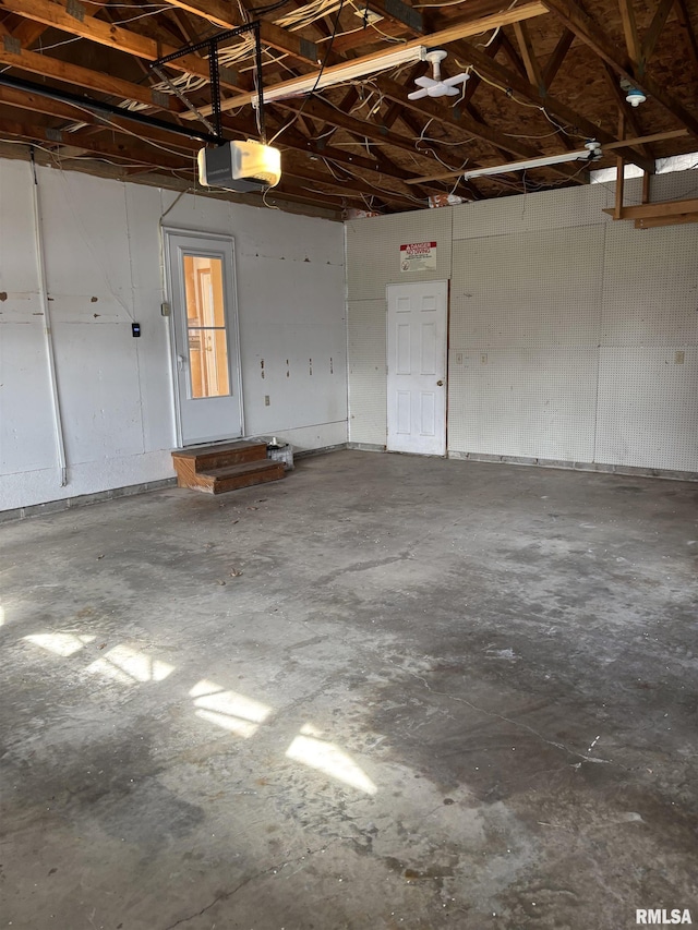 2110 Magnolia Dr, Jacksonville, IL 62650 - garage with a garage door opener