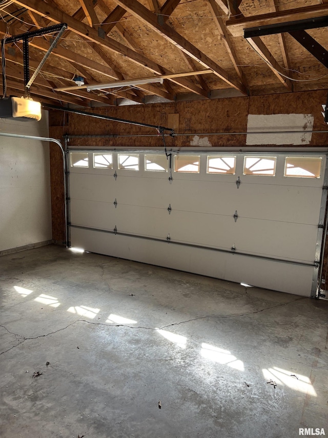 2110 Magnolia Dr, Jacksonville, IL 62650 - garage featuring a garage door opener