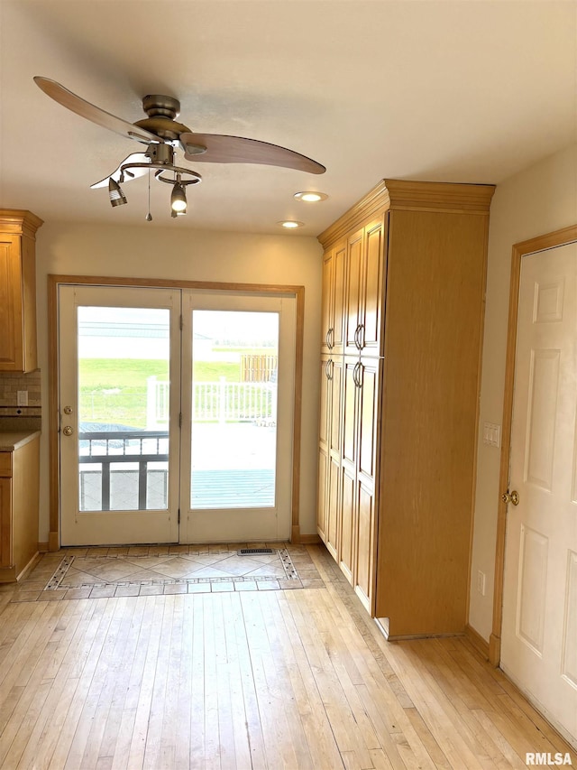 2110 Magnolia Dr, Jacksonville, IL 62650 - entryway featuring recessed lighting, light wood-type flooring, baseboards, and ceiling fan