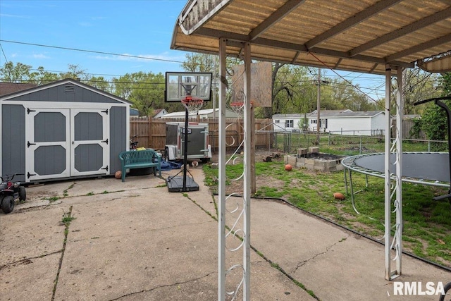 417 N Stephens Ave, Springfield, IL 62702 - fenced backyard featuring a trampoline and a patio area