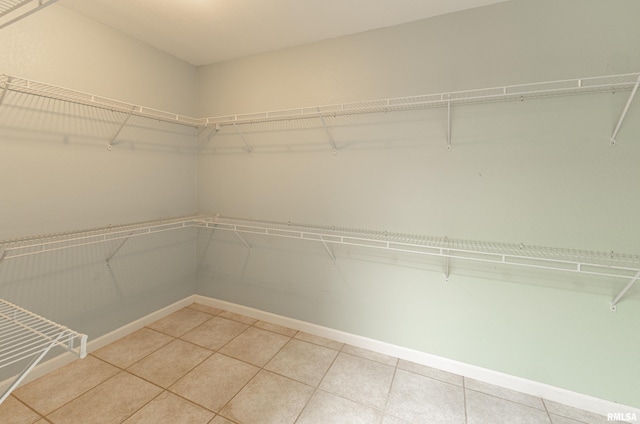 spacious closet featuring light tile patterned flooring