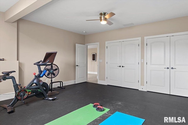 exercise area featuring baseboards and a ceiling fan