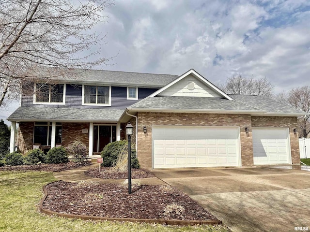 3096 Whitehaven Cir, Galesburg, IL 61401 - traditional-style home featuring an attached garage, roof with shingles, brick siding, and concrete driveway