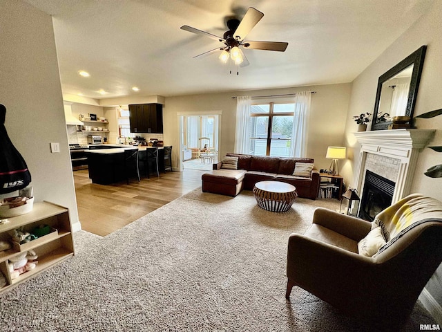 3096 Whitehaven Cir, Galesburg, IL 61401 - living room with a tile fireplace, light wood-style flooring, recessed lighting, and ceiling fan