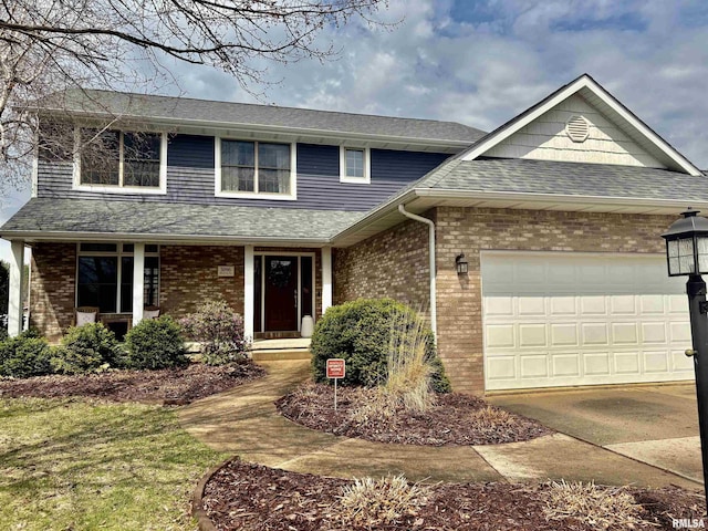 3096 Whitehaven Cir, Galesburg, IL 61401 - traditional-style home with a garage, brick siding, roof with shingles, and driveway