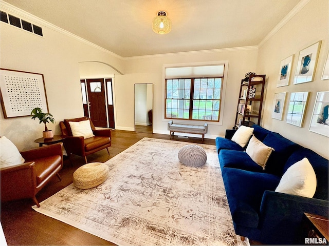 3096 Whitehaven Cir, Galesburg, IL 61401 - living area with wood finished floors, visible vents, ornamental molding, arched walkways, and baseboards