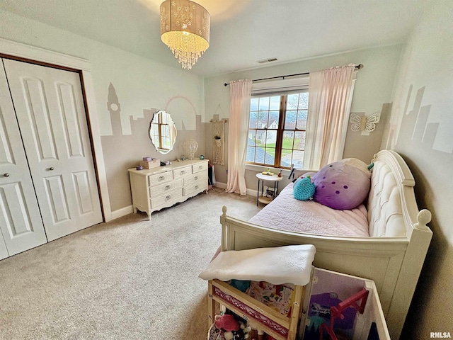 3096 Whitehaven Cir, Galesburg, IL 61401 - bedroom featuring a closet, visible vents, baseboards, and light carpet