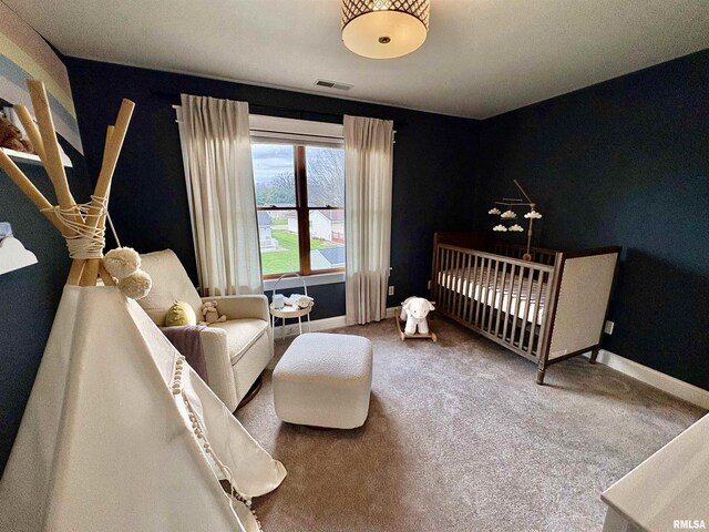 3096 Whitehaven Cir, Galesburg, IL 61401 - bedroom with carpet floors, visible vents, a crib, and baseboards