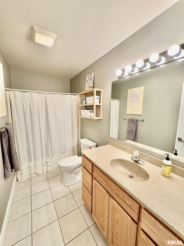 3096 Whitehaven Cir, Galesburg, IL 61401 - full bath with a textured ceiling, tile patterned floors, vanity, and toilet