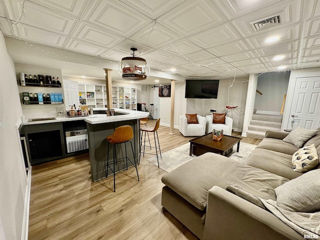 3096 Whitehaven Cir, Galesburg, IL 61401 - bar featuring wet bar, an ornate ceiling, visible vents, and light wood-type flooring