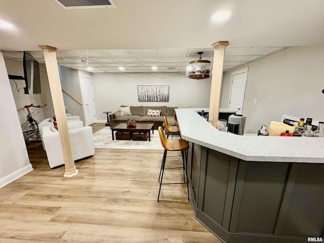 3096 Whitehaven Cir, Galesburg, IL 61401 - interior space featuring open floor plan, light wood-type flooring, light countertops, baseboards, and visible vents