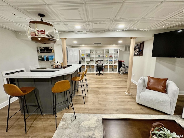 3096 Whitehaven Cir, Galesburg, IL 61401 - bar with baseboards, wet bar, and decorative columns