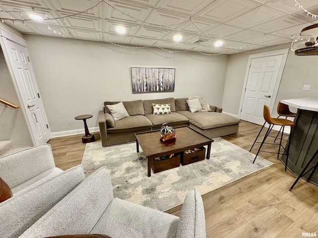 3096 Whitehaven Cir, Galesburg, IL 61401 - living room with light wood-style flooring, baseboards, and an ornate ceiling
