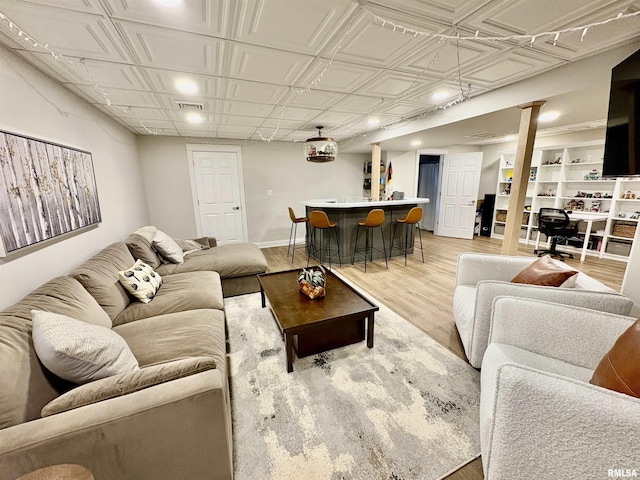 3096 Whitehaven Cir, Galesburg, IL 61401 - living area featuring an ornate ceiling, visible vents, recessed lighting, bar, and light wood-style floors