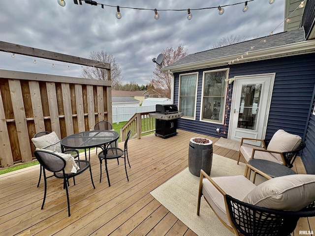 3096 Whitehaven Cir, Galesburg, IL 61401 - wooden terrace featuring fence, outdoor dining area, and a grill