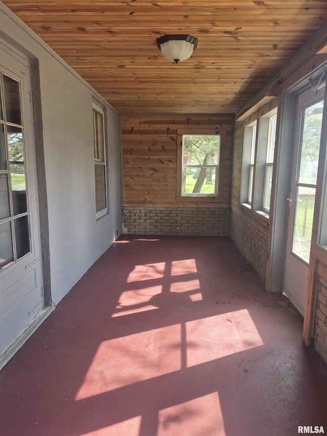unfurnished sunroom featuring a wealth of natural light