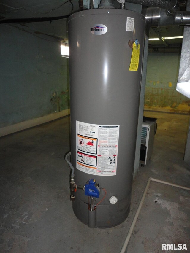 utility room featuring gas water heater