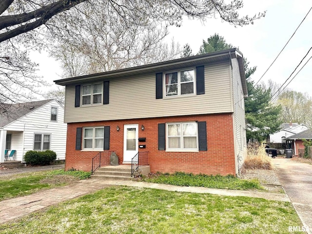 1038 W Maple Ave, Springfield, IL 62704 - colonial inspired home with a front lawn and brick siding