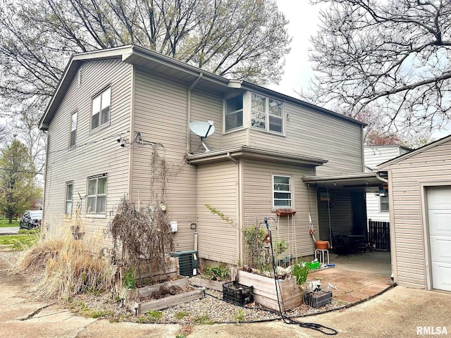 1038 W Maple Ave, Springfield, IL 62704 - exterior space with central air condition unit and a garden