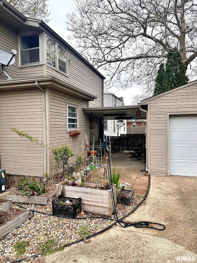 1038 W Maple Ave, Springfield, IL 62704 - exterior space with a garage and fence