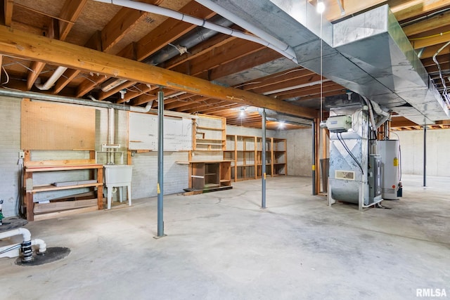 unfinished basement featuring water heater