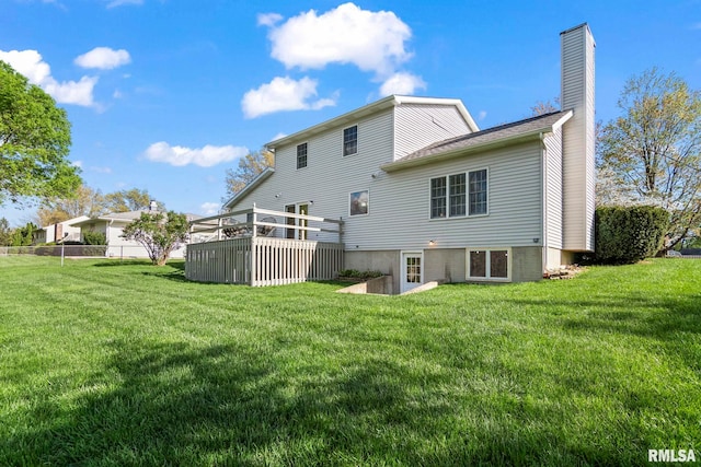 back of property with a lawn and a chimney