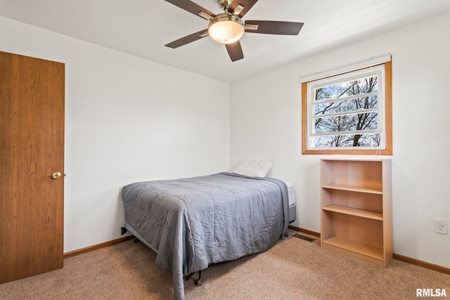bedroom featuring ceiling fan, baseboards, and carpet flooring