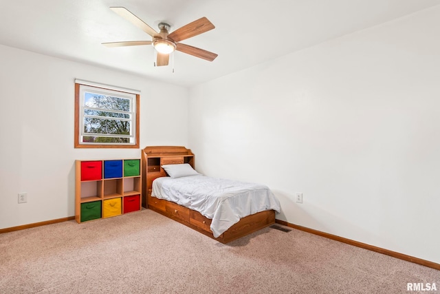 bedroom with visible vents, baseboards, carpet, and ceiling fan