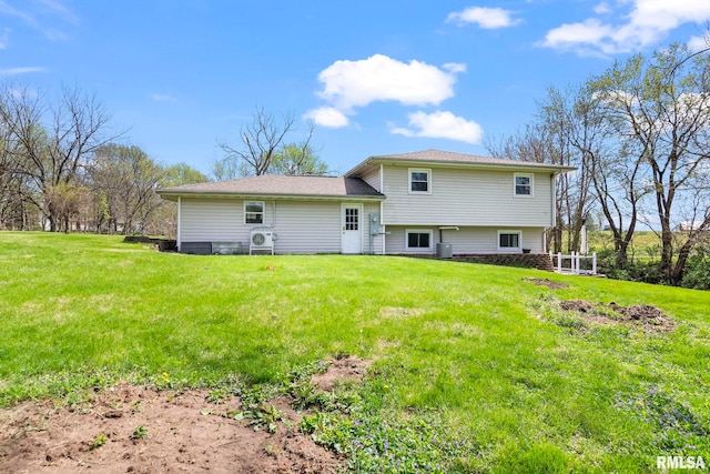 back of property featuring cooling unit and a lawn
