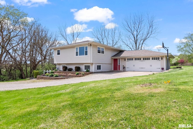 split level home with an attached garage, gravel driveway, and a front yard