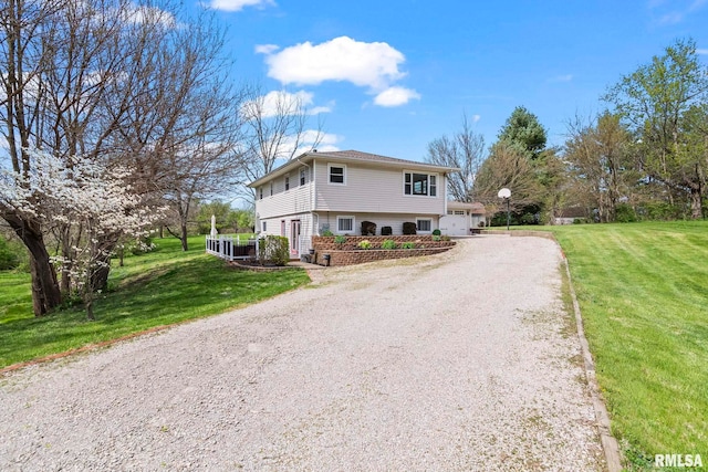 view of front of home featuring driveway and a front yard