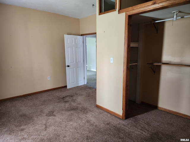 403 S Elm St, Lincoln, IL 62656 - unfurnished bedroom featuring carpet and a closet