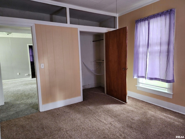 403 S Elm St, Lincoln, IL 62656 - unfurnished bedroom featuring carpet flooring and a closet