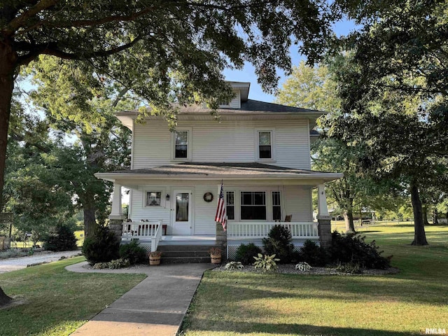 323 E Cortland St, Avon, IL 61415 - american foursquare style home with a porch and a front yard