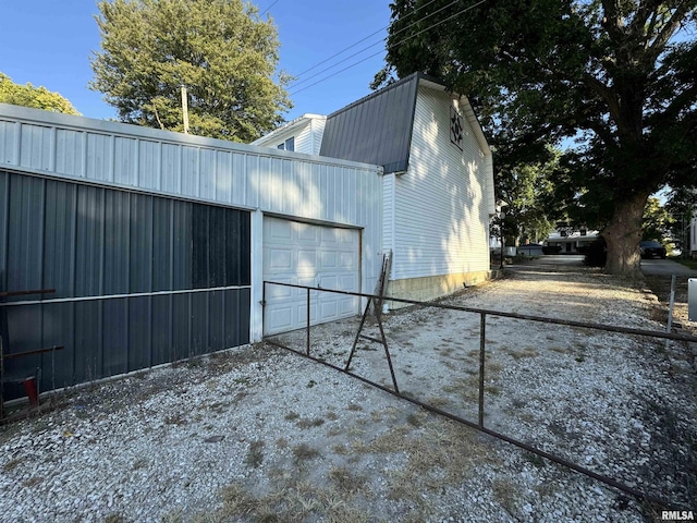 323 E Cortland St, Avon, IL 61415 - exterior space with a garage and concrete driveway