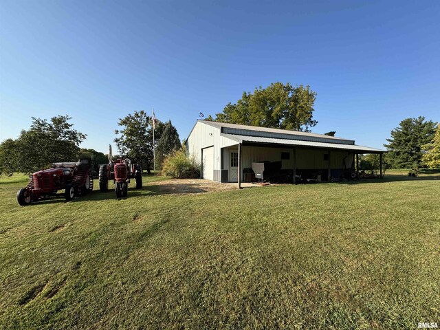 323 E Cortland St, Avon, IL 61415 - view of yard featuring an outdoor structure, a pole building, and a garage
