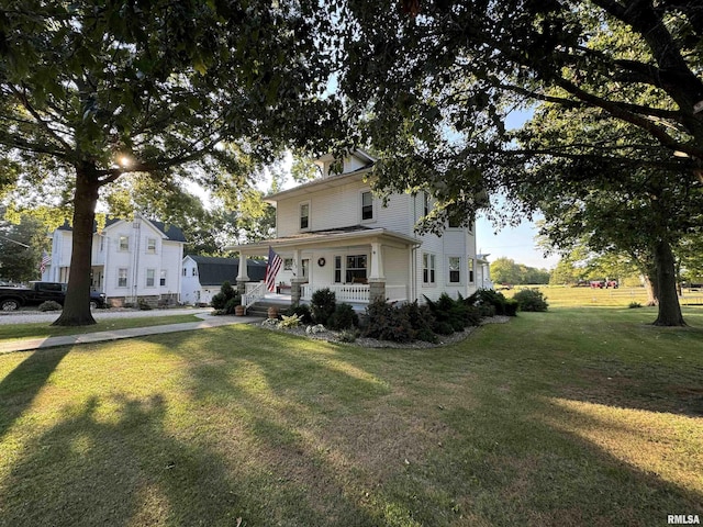323 E Cortland St, Avon, IL 61415 - view of front of home with covered porch and a front yard