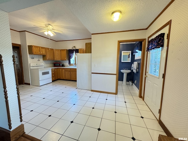 323 E Cortland St, Avon, IL 61415 - kitchen featuring a sink, brown cabinetry, white appliances, light countertops, and ornamental molding