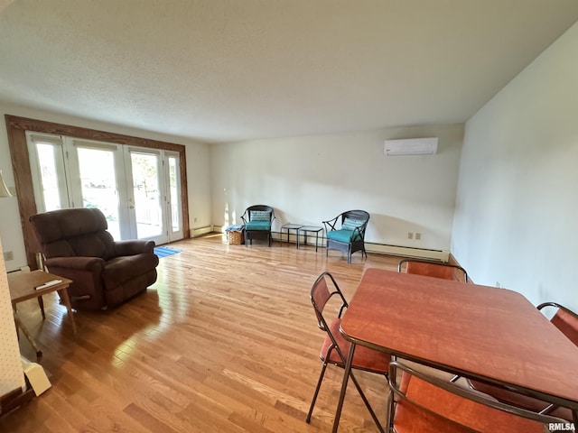 323 E Cortland St, Avon, IL 61415 - interior space featuring light wood finished floors, an AC wall unit, french doors, a baseboard heating unit, and a baseboard radiator