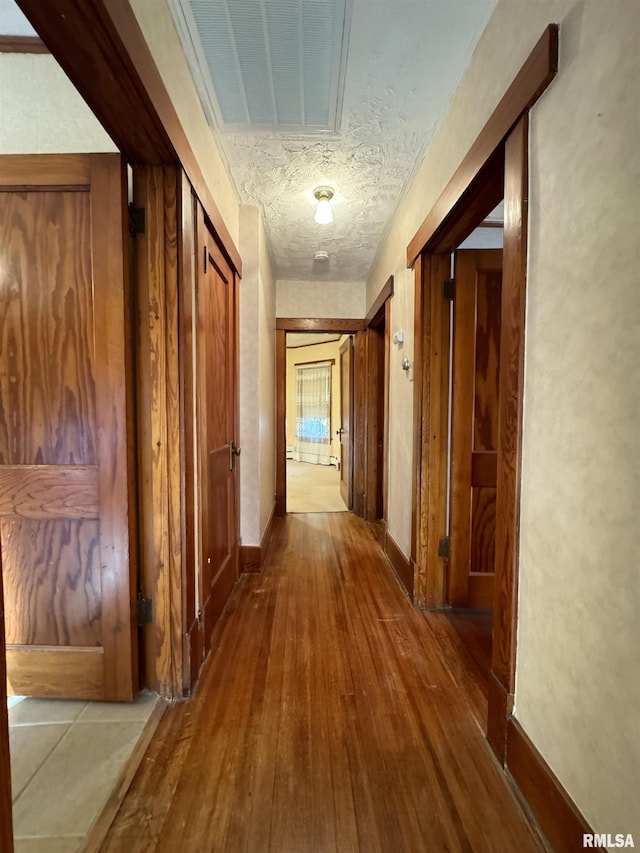 323 E Cortland St, Avon, IL 61415 - hallway featuring hardwood / wood-style flooring, baseboards, and visible vents