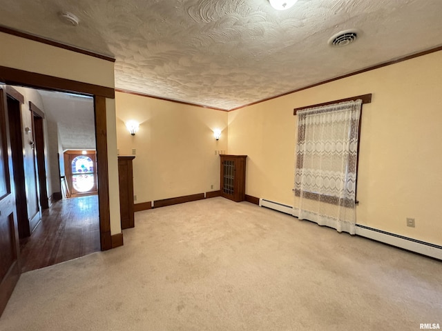 323 E Cortland St, Avon, IL 61415 - spare room featuring baseboards, crown molding, visible vents, and carpet