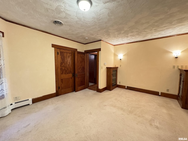 323 E Cortland St, Avon, IL 61415 - unfurnished bedroom with carpet, visible vents, and crown molding
