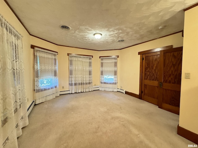323 E Cortland St, Avon, IL 61415 - spare room featuring visible vents, carpet floors, and ornamental molding