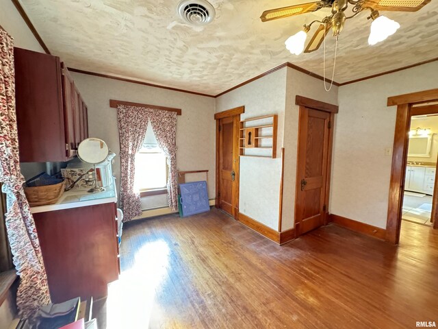 323 E Cortland St, Avon, IL 61415 - bedroom with light wood-style floors and crown molding