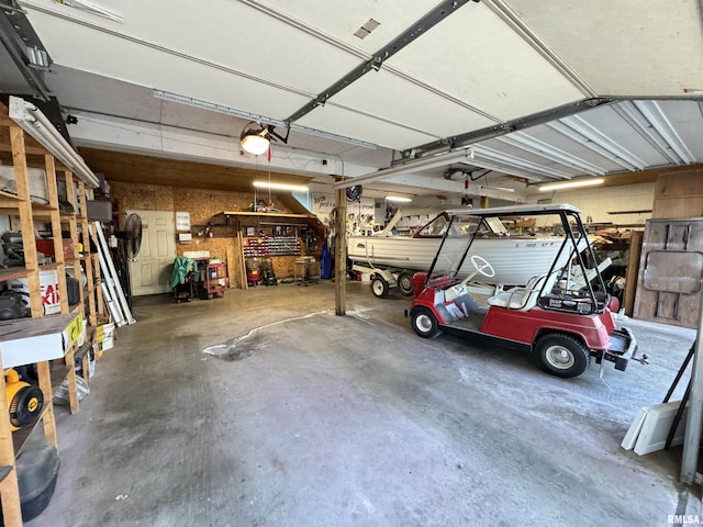 323 E Cortland St, Avon, IL 61415 - garage featuring a workshop area and a garage door opener