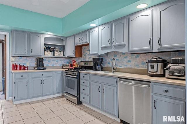 kitchen featuring light countertops, backsplash, open shelves, light tile patterned flooring, and appliances with stainless steel finishes